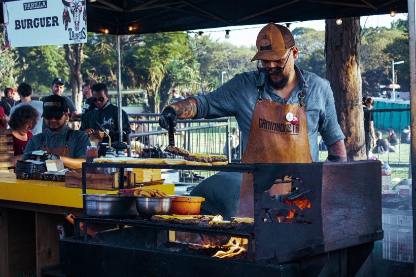 man grilling patties